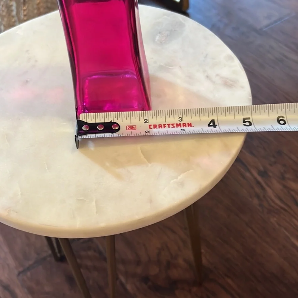 Pink glass narrow 7.5” tall 2.25” wide at widest part top & bottom, 1.75” middle